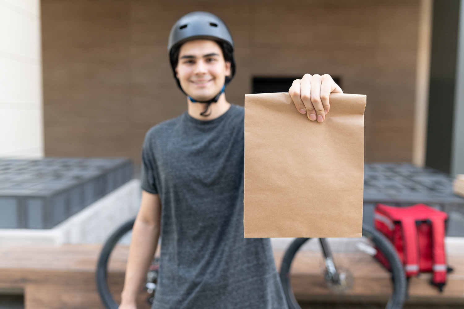 Food Delivery Man Holding Paper Bag